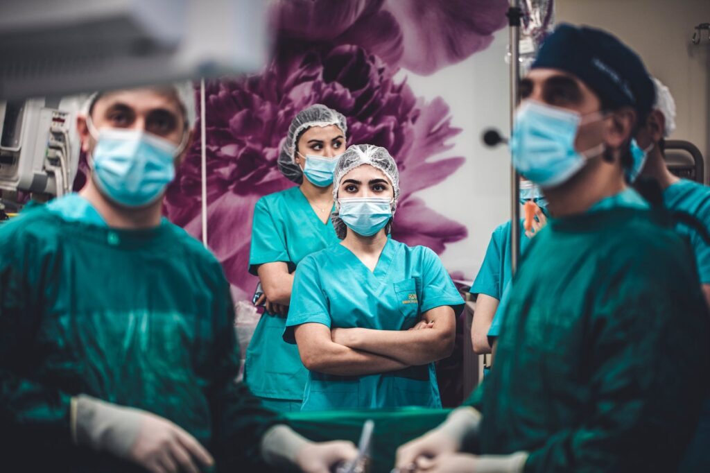 healthcare workers wearing scrubs and masks