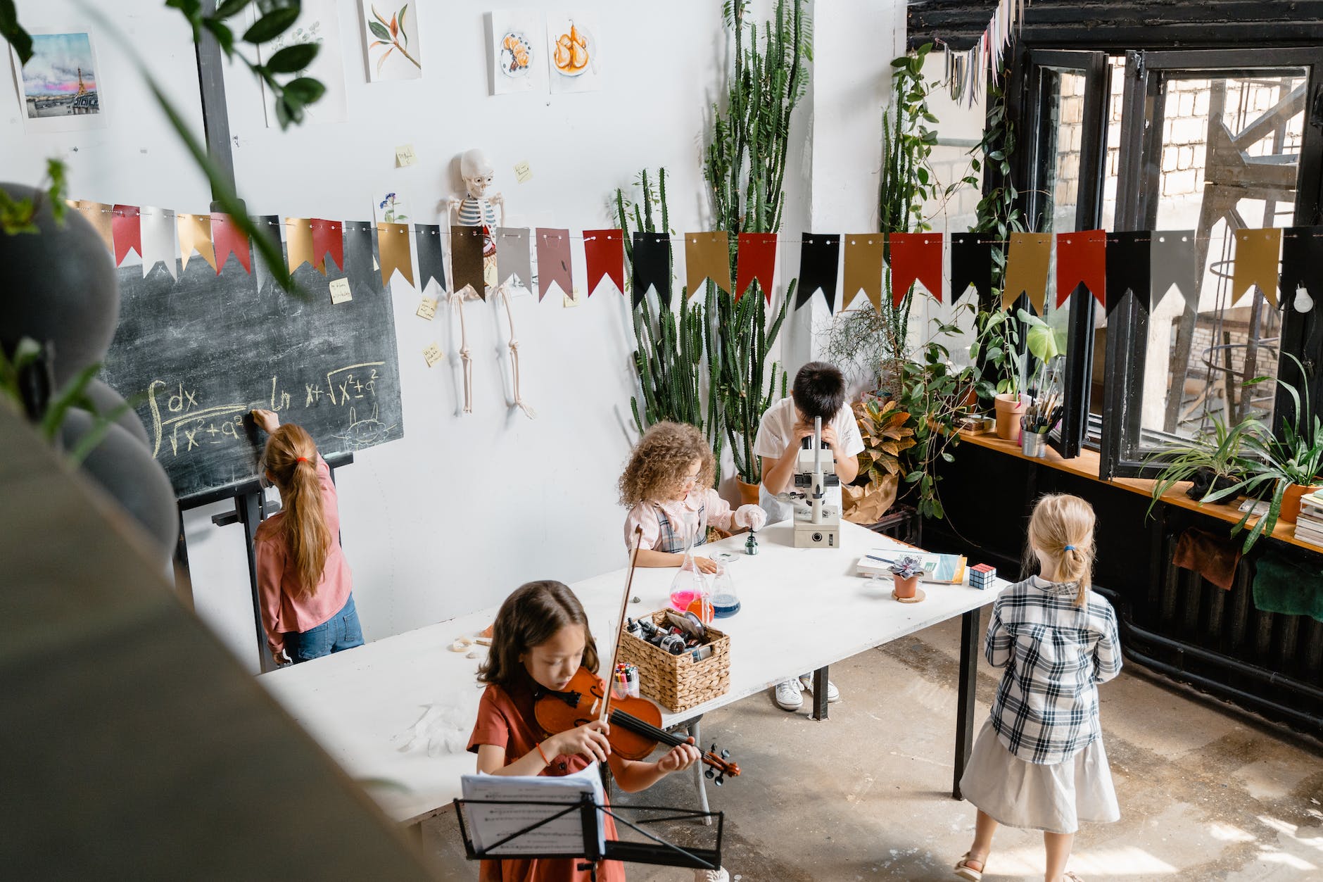 kids doing different activities inside a room