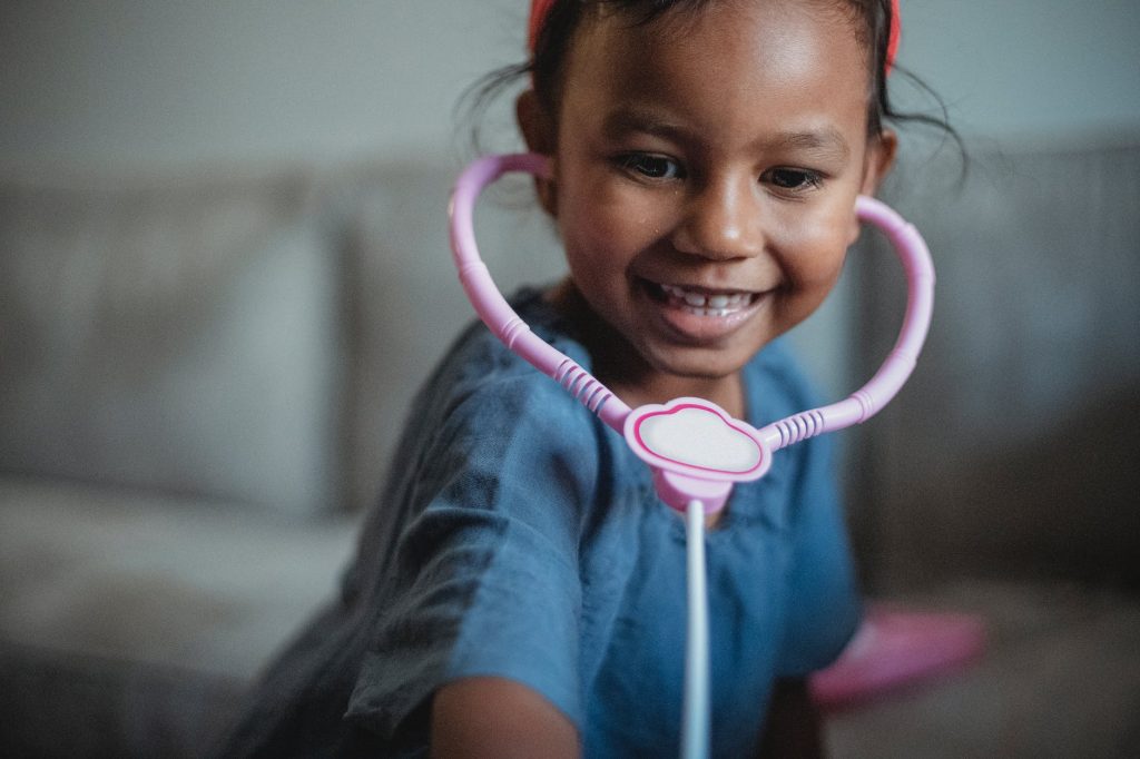 a child with a stethoscope